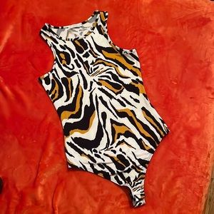 Never worn Cheetah like bodysuit by Timing in size M. Both casual and sexy.